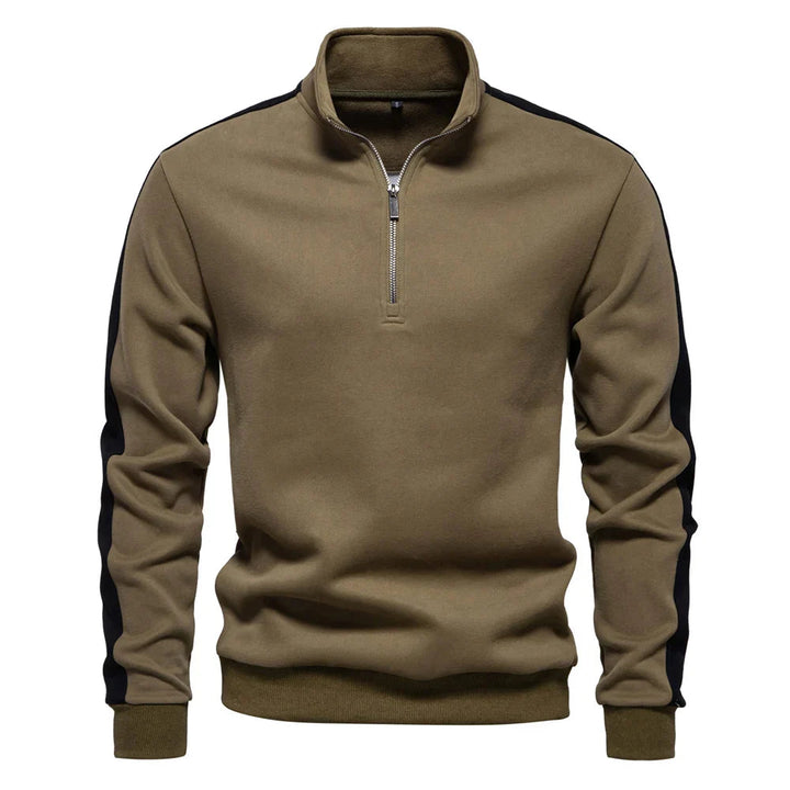Moderner Herrenpullover aus weichem Material mit Viertelreißverschluss und elegantem Schnitt.