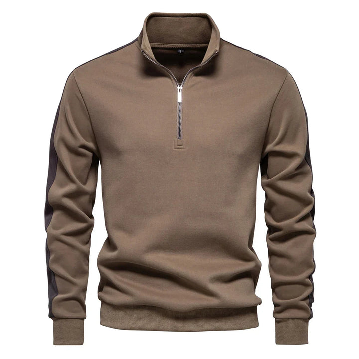 Moderner Herrenpullover aus weichem Material mit Viertelreißverschluss und elegantem Schnitt.
