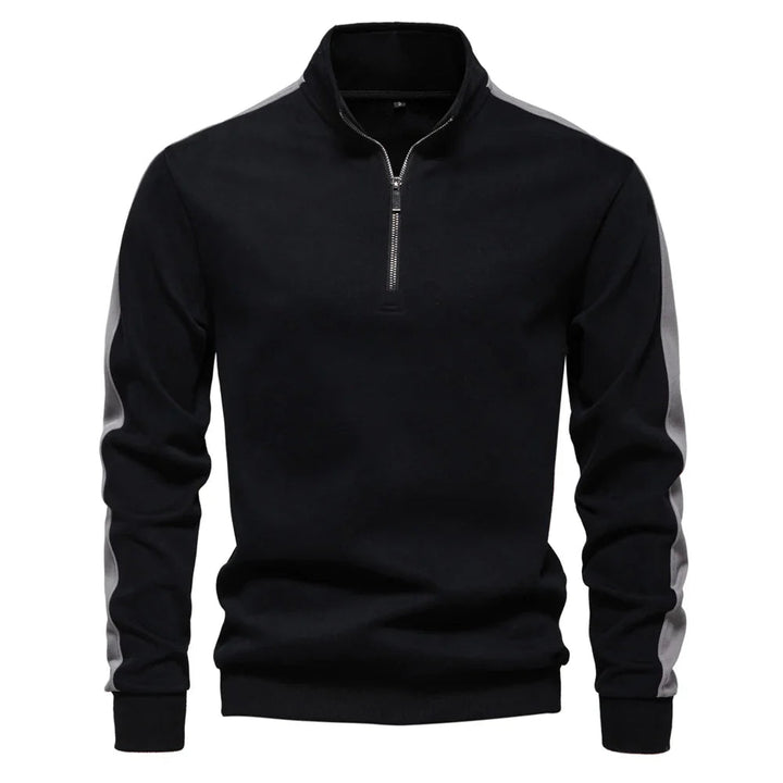 Moderner Herrenpullover aus weichem Material mit Viertelreißverschluss und elegantem Schnitt.